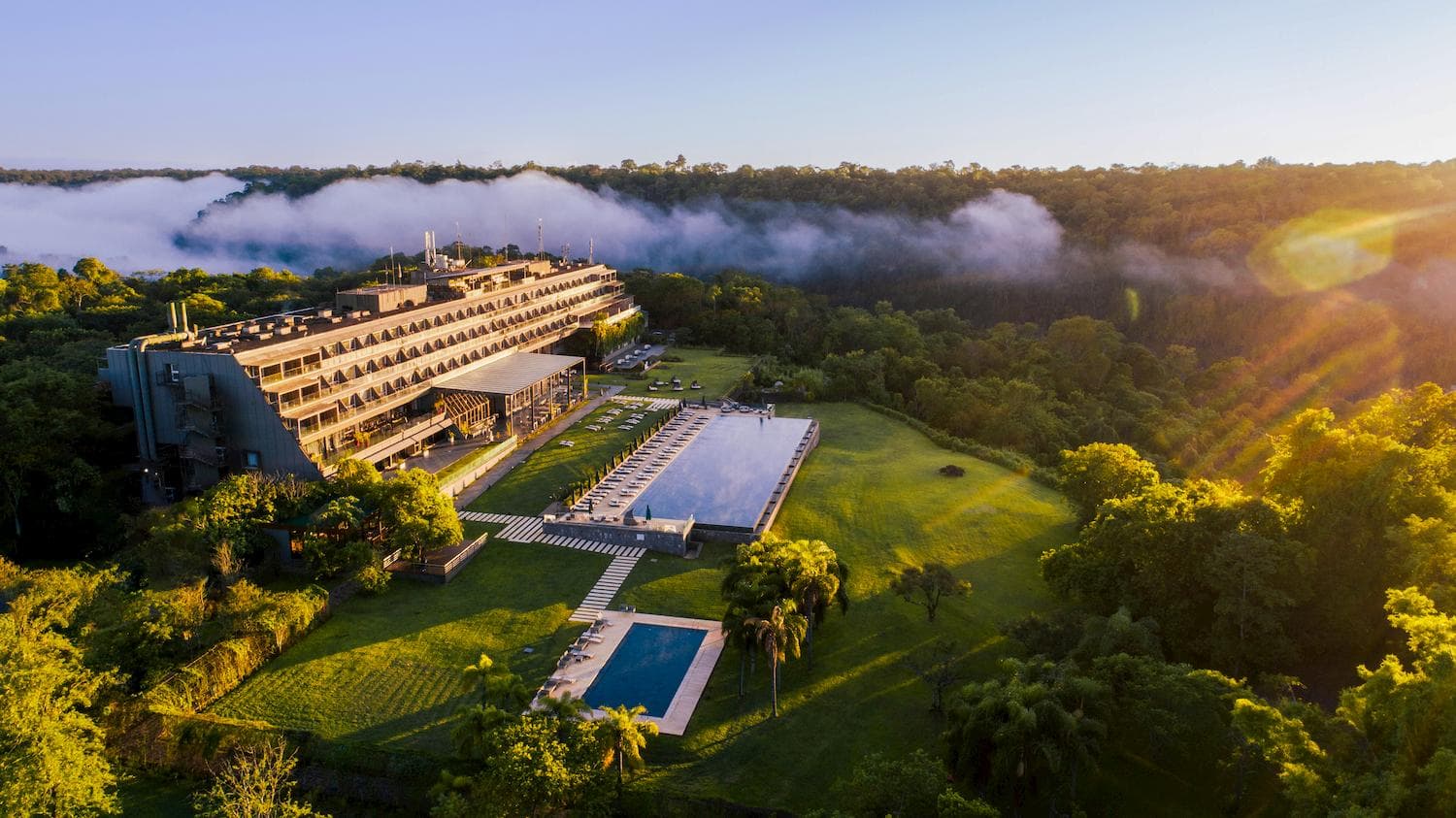 Aerial view of the Gran Meliá Iguazú resort set among dense rainforest.